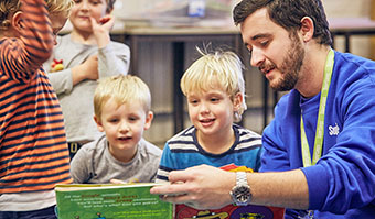 Younger children reading indoors
